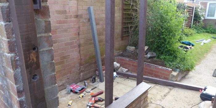 Posts Being Attached To The Dried Brick Walls
